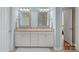 Bathroom featuring double vanity sinks, granite countertops, and white cabinetry at 1400 Coachman Dr, Waxhaw, NC 28173