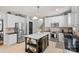 Well-lit kitchen featuring stainless steel appliances, a center island, and white cabinetry at 1400 Coachman Dr, Waxhaw, NC 28173