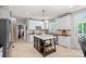 Well-appointed kitchen with white cabinets, a center island, tile backsplash, and stainless steel appliances at 1400 Coachman Dr, Waxhaw, NC 28173