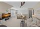 Open living room with media center, comfortable seating, and shuttered windows for natural light at 1400 Coachman Dr, Waxhaw, NC 28173