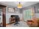Home office with wood floors, wainscoting, a large window, and a comfortable leather chair at 1400 Coachman Dr, Waxhaw, NC 28173