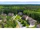 A beautiful aerial view shows the landscaping and mature trees surrounding the homes in the neighborhood at 1410 Smoketree Ct, Waxhaw, NC 28173