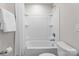 A clean white bathroom with shower and tub and white tile at 1410 Smoketree Ct, Waxhaw, NC 28173
