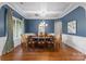 Spacious dining room with coffered ceiling, chandelier, and large windows at 1410 Smoketree Ct, Waxhaw, NC 28173