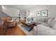 The living room has hardwood floors, neutral furniture, and is a cozy and inviting space at 1410 Smoketree Ct, Waxhaw, NC 28173