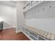 This mudroom features a built-in bench with storage, hooks, and overhead storage at 1410 Smoketree Ct, Waxhaw, NC 28173