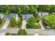 Aerial shot of a home with a well-manicured lawn and mature trees in a quiet neighborhood at 14849 Middlesborough Dr, Matthews, NC 28104