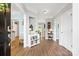 Inviting entryway with hardwood floors, neutral paint, and views to adjoining rooms at 14849 Middlesborough Dr, Matthews, NC 28104