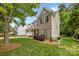 Beautiful two-story home with a well-manicured lawn and mature trees in a desirable neighborhood at 14849 Middlesborough Dr, Matthews, NC 28104