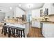 Kitchen boasts an island with seating, stainless steel appliances, and stylish cabinets at 14849 Middlesborough Dr, Matthews, NC 28104