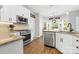Bright kitchen has stainless steel appliances, granite countertops, and ample cabinet space at 14849 Middlesborough Dr, Matthews, NC 28104