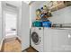 This laundry room features shelving and a modern washer and dryer at 14849 Middlesborough Dr, Matthews, NC 28104