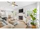 Inviting living room features a cozy fireplace, neutral tones, and lots of natural light at 14849 Middlesborough Dr, Matthews, NC 28104