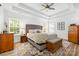 Spacious main bedroom features a decorative rug, natural light, and a neutral color palette at 14849 Middlesborough Dr, Matthews, NC 28104