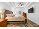 Serene main bedroom with tray ceiling, large bed, and calming neutral color palette at 14849 Middlesborough Dr, Matthews, NC 28104