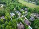 Expansive aerial view of several homes with pools in a lush, established neighborhood at 1504 Alydar Ct, Waxhaw, NC 28173