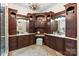 Elegant bathroom with custom wood cabinets, dual sinks, and ample counter space at 1504 Alydar Ct, Waxhaw, NC 28173
