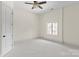 Spacious bedroom featuring neutral tones, carpeted floors, and a window at 1504 Alydar Ct, Waxhaw, NC 28173