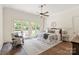 Cozy bedroom with a ceiling fan, a neutral color palette and access to a private patio at 1504 Alydar Ct, Waxhaw, NC 28173