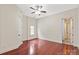 Bedroom featuring hardwood floors, neutral tones, one window, and a ceiling fan at 1504 Alydar Ct, Waxhaw, NC 28173