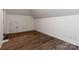 An empty bedroom featuring light walls and flooring, a small closet, and an angled ceiling at 1504 Alydar Ct, Waxhaw, NC 28173