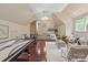Spacious bonus room featuring hardwood floors, ample seating, game table and a kitchenette at 1504 Alydar Ct, Waxhaw, NC 28173