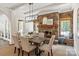 Inviting dining room with stone fireplace, wooden mantel, and a cozy window seat at 1504 Alydar Ct, Waxhaw, NC 28173
