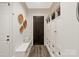 Hallway with a bench, storage and access to the front door at 1504 Alydar Ct, Waxhaw, NC 28173
