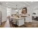 Gourmet kitchen featuring white cabinets, granite countertops, and a copper range hood at 1504 Alydar Ct, Waxhaw, NC 28173