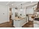 Bright kitchen features a large island, stainless steel appliances, and white cabinets at 1504 Alydar Ct, Waxhaw, NC 28173
