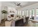 Elegant living room with fireplace, white trim, and french doors leading to the outdoor space at 1504 Alydar Ct, Waxhaw, NC 28173