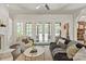 Bright living room with a fireplace, french doors leading to the outdoor space, and neutral furnishings at 1504 Alydar Ct, Waxhaw, NC 28173