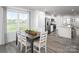 Open dining area with views of the modern kitchen and lots of natural light at 153 Jameson Park Dr # 4, Troutman, NC 28166