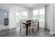 Cozy dining area with dark wood table and views of the neighborhood at 153 Jameson Park Dr # 4, Troutman, NC 28166