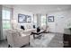 Comfortable living room with neutral furniture, modern artwork, and lots of natural light at 153 Jameson Park Dr # 4, Troutman, NC 28166