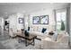 Bright living room with large windows, neutral furnishings, and stylish decor at 153 Jameson Park Dr # 4, Troutman, NC 28166