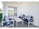 Outdoor patio featuring a white outdoor seating set and a sliding glass door leading inside at 153 Jameson Park Dr # 4, Troutman, NC 28166