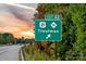 Road sign indicating the exit for Troutman along highway 21/115 against a scenic sky at 153 Jameson Park Dr # 4, Troutman, NC 28166