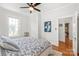 Bright bedroom featuring hardwood floors and doorway to an adjoining room at 1822 Hall Ave, Charlotte, NC 28205