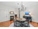 Charming dining room with a fireplace, hardwood floors, and a stylish chandelier at 1822 Hall Ave, Charlotte, NC 28205