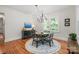 Bright dining area featuring hardwood floors, natural light, and a decorative chandelier at 1822 Hall Ave, Charlotte, NC 28205