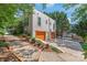 Spacious garage with multiple doors and ample parking space, complemented by tasteful landscaping at 1822 Hall Ave, Charlotte, NC 28205