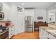 Updated kitchen featuring stainless steel appliances, granite countertops, and white cabinetry at 1822 Hall Ave, Charlotte, NC 28205