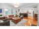 Open floor plan with a living room that flows into a modern kitchen with a breakfast bar and pendant lights at 1822 Hall Ave, Charlotte, NC 28205