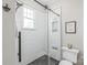 Shower with black framed glass, white subway tile, and sleek black shower fixtures at 1822 Hall Ave, Charlotte, NC 28205