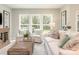 Bright living room with large windows offering backyard views, comfortable seating, and stylish decor at 2008 Waxhaw Crossing Dr, Waxhaw, NC 28205