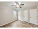 Bright bedroom featuring hardwood floors, a ceiling fan, and neutral paint, creating a peaceful retreat at 201-A Ewing Dr, Belmont, NC 28012