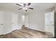 This bedroom features hardwood floors, neutral paint, and access to an ensuite bathroom at 201-A Ewing Dr, Belmont, NC 28012