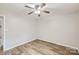 Cozy bedroom boasts stylish hardwood floors, neutral paint, and lots of natural light at 201-A Ewing Dr, Belmont, NC 28012