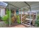 Charming home exterior featuring a covered porch, carport, and well-maintained landscaping at 201-A Ewing Dr, Belmont, NC 28012